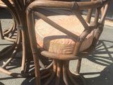 a table and chairs that are outside on the sidewalk