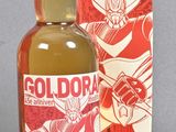 a bottle of gold orak next to a box of gold orak