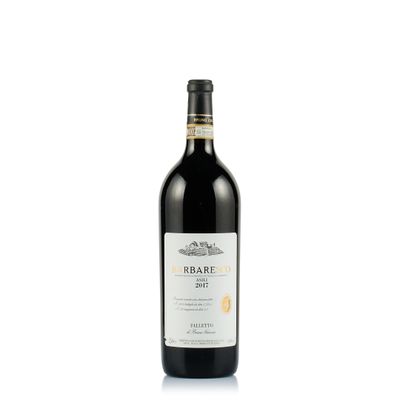 une bouteille de vin rouge posée sur une table blanche