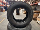two tires stacked on top of each other in a warehouse