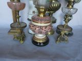 a lot of vases that are sitting on a table