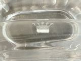 a clear glass container with a crown on it