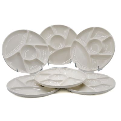 five plates that are sitting on top of each other