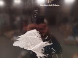 a man taking a picture of a reflection in a mirror