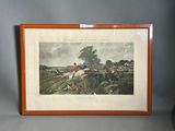 a framed print of a horse and rider in a landscape