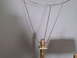 a lamp that is on a table next to a lamp shade