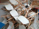 a pile of chairs that are stacked on top of each other