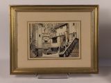 framed picture of a drawing of a building in a gold frame