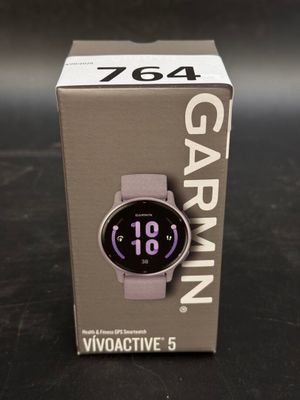 the watch is in the box on the table next to the box