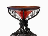 an image of a table with a red glass bowl on it