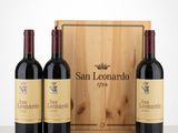 three bottles of wine in front of a wooden box on a table