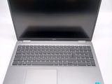 an open laptop computer sitting on top of a white table