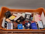 a basket full of books and other items in it