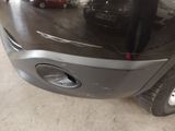 an image of a car that is parked in a garage