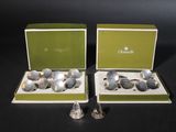 pair of silver plated salt and pepper shakers in boxes