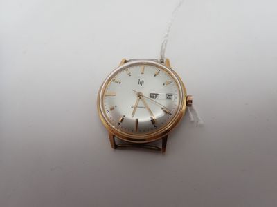 an image of a watch on a white surface with a chain around it