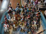 a lot of figurines that are sitting on a table