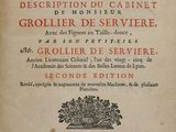 an old book with french writing on it sitting on top of a table