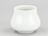 white porcelain vase with a white base on a gray surface