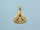 a close up of a gold plated pendant with a slice of pizza on it