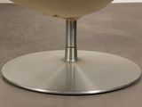 a glass of wine sitting on top of a table