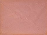 an old envelope with a torn piece of paper on it