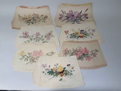 several pieces of cloth with floral designs on them on a table