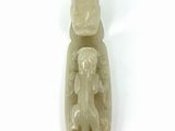 an image of a carved stone figurine of a man and a woman