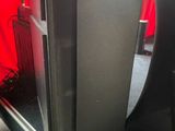 two speakers that are sitting next to each other on a table
