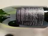 a bottle of wine that is sitting on a table