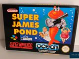 une image représentant une boîte de « Super James Pond » sur laquelle figure un personnage de dessin animé