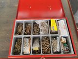 a red tool box filled with lots of screws and nuts