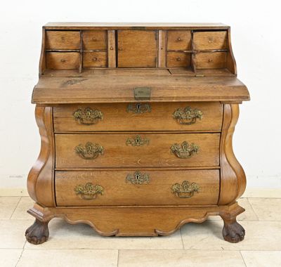 a wooden desk with a drawer on top of it