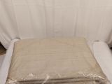 the sheets are wrapped in plastic and ready to be placed on the bed