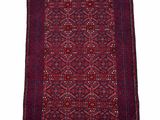 a red rug with fringes on a white background