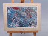 un petit chevalet sur lequel est posé un tableau