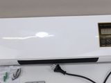 an image of a white air conditioner sitting on top of a table