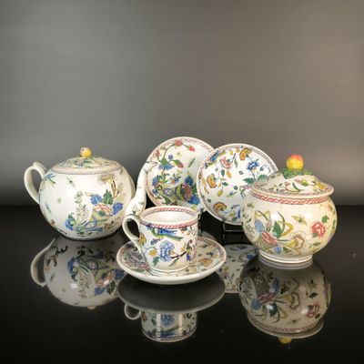 four different types of teapots and cups on a table