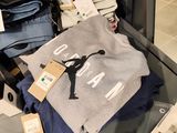 a suitcase full of clothing and a bag of luggage