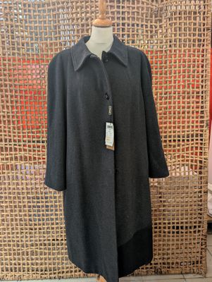 a woman ' s coat on a mannequin mannequin mannequin mannequin mannequin mannequin mannequin mannequin mann