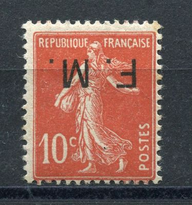 an old stamp with a woman on it on a black surface