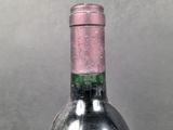 a bottle of wine that is sitting on a table