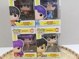 four pop vinyl figures of anime characters in a basket on top of a table