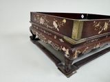 a large wooden box with flowers and birds painted on it