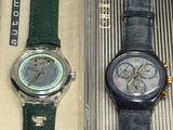 two watches that are in a box on the table