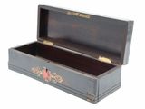 a small wooden box with a red heart in it