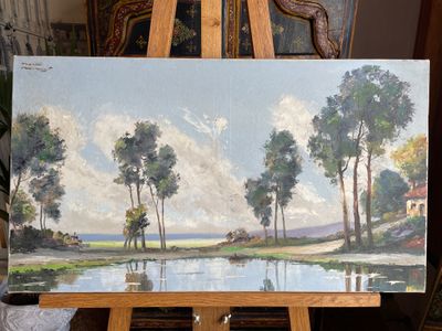 a painting that is on a easel in a room