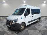 the white van is parked in a large room with a checkered floor