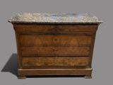an antique chest of drawers with marble top on a grey background