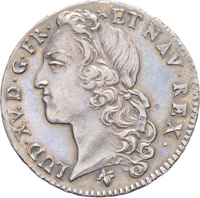 gros plan d'une pièce de monnaie sur laquelle figure un visage de femme